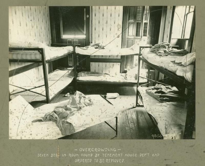 Photo of a tenement room in 1902 taken during an inspection by the New York City Tenement House Department