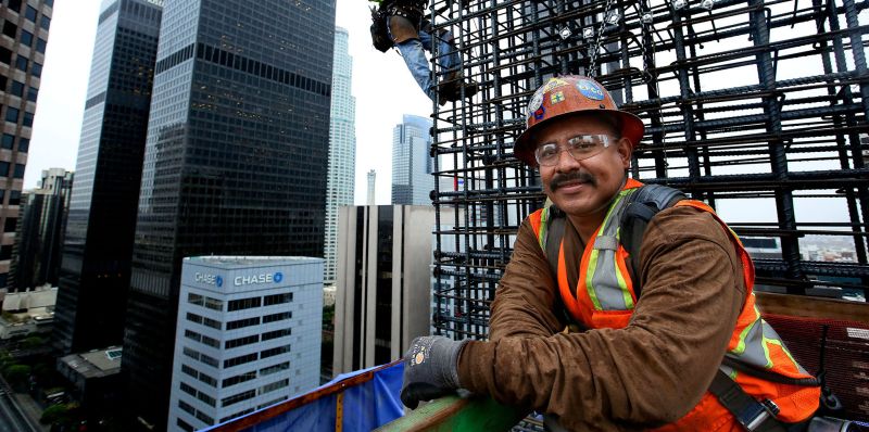 Working 300 feet above downtown los angeles, ironworkers position reinforcing steel onto the walls of the new wilshire grand. "this is dangerous work," says foreman otto solis, "but it can change your life. "
