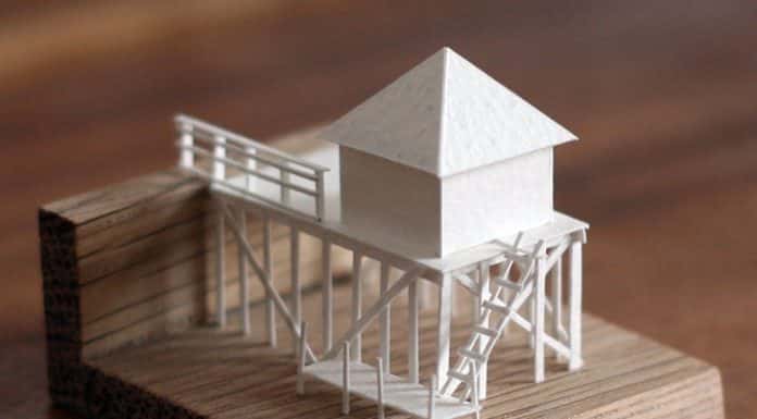 Every day, artist Charles Young creates a miniature building out of paper and glue