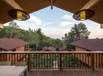 Wooden houses in cadiretes forest, spain / dosarquitectes