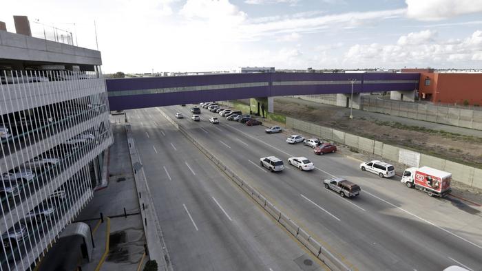 Pedestrian bridge opens on u. S. -mexico border that links san diego and tijuana airport