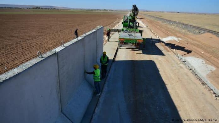 Turkey builds more than half of Syrian border wall