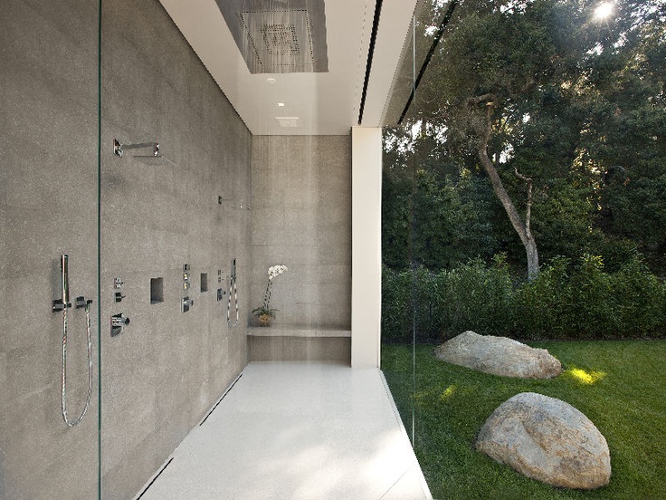The minimalist and modern shower connected with the garden