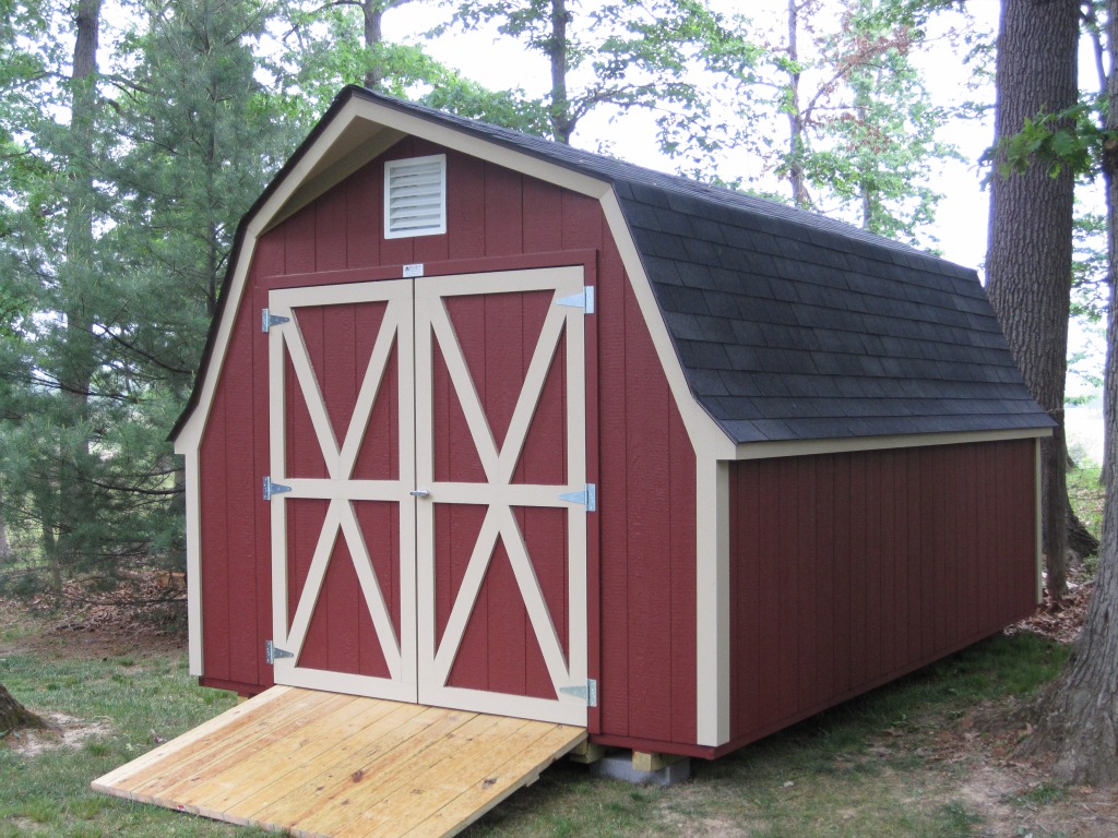 A barn house featuring a gambrel roof