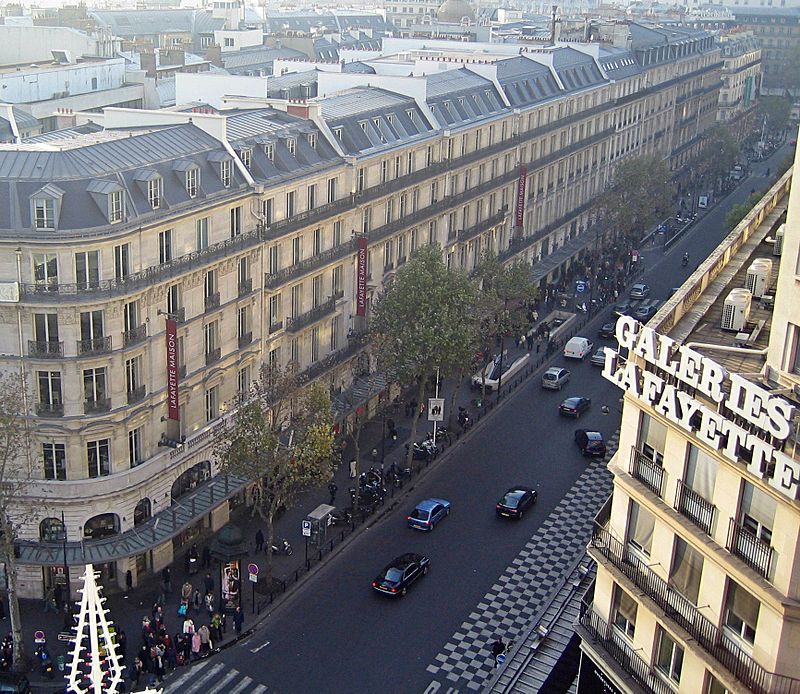 An aerial view of mansard rooftops along boulevard haussmann in paris