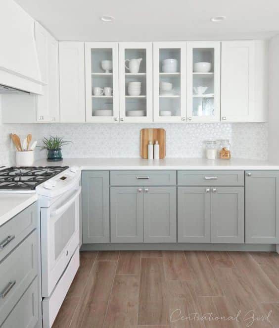 Top white kitchen cabinets with light gray bottom cabinets and white countertop