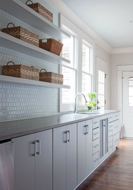 Gray kitchen cabinets on bluish gray countertop