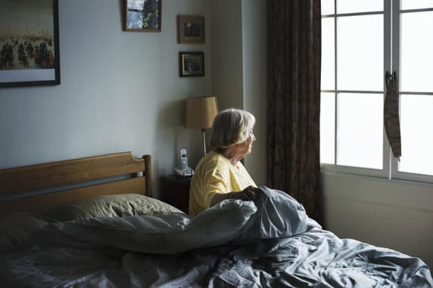 Senior woman sitting bedroom 53876 8