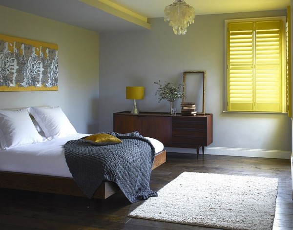 Shutters add cheerful yellow glow to the bedroom