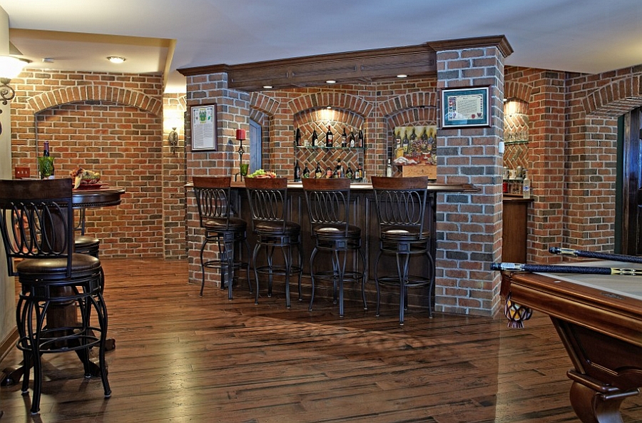 Pub style basement bar with a beautiful brick backdrop