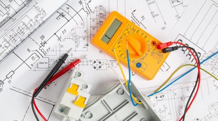electrical drawings, switch, circuit breakers, cutting box and digital multimeter. installation of power supply systems