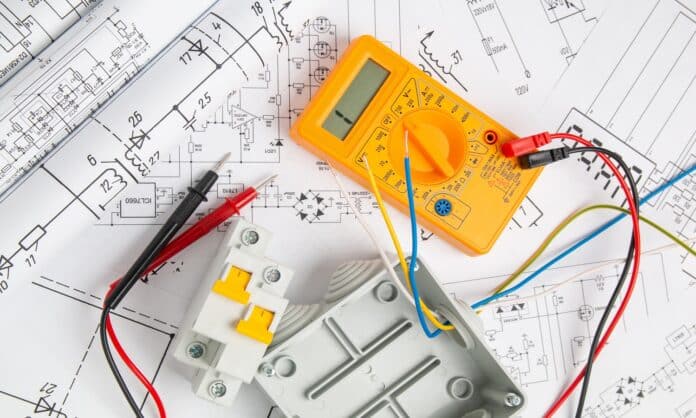 electrical drawings, switch, circuit breakers, cutting box and digital multimeter. installation of power supply systems