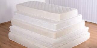 Many mattress in a pyramid in the room.