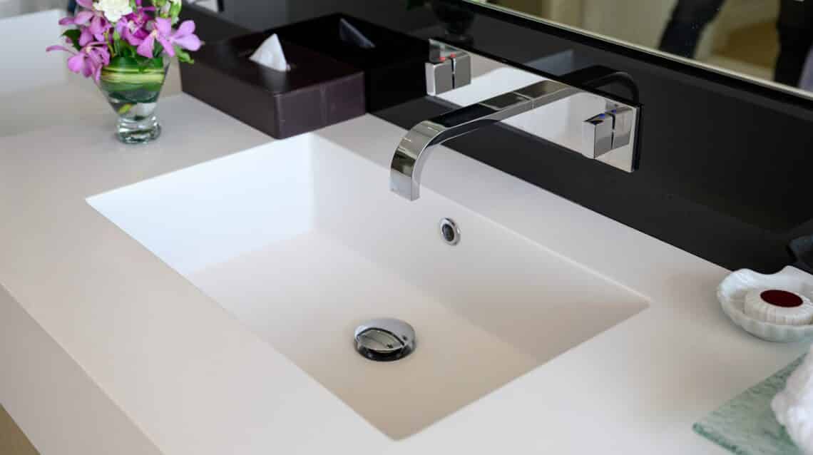 Modern luxury stainless faucet with ceramic sink of automatic sensor and cool with heat control button in bathroom