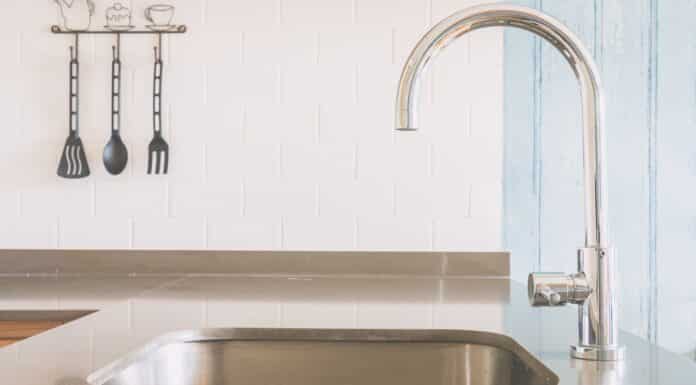 Faucet sink at kitchen - vintage light tone filter