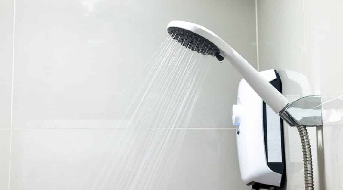 Water flowing from shower in the bathroom.