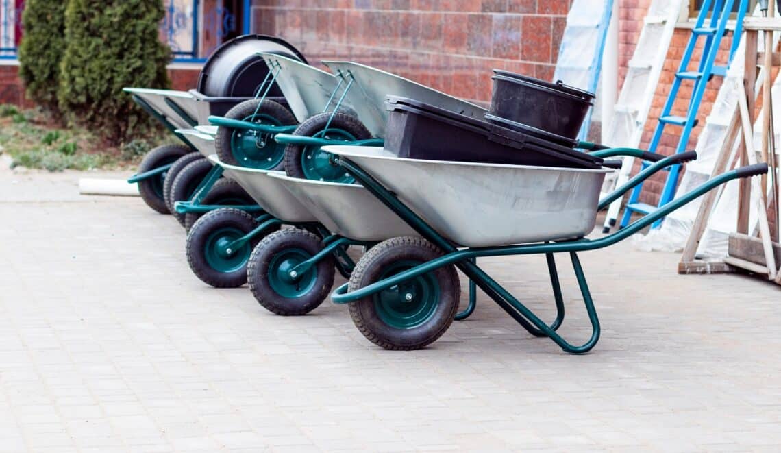 Garden and vegetable garden concept. Garden wheelbarrows outdoor for sale in spring season