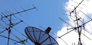 concpetual of satellite and antenna on blue sky