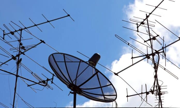 concpetual of satellite and antenna on blue sky