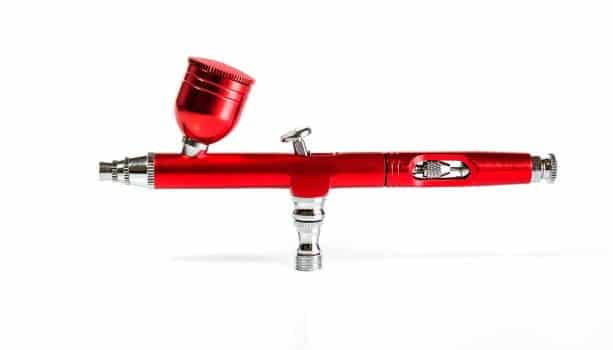 Red airbrush spray tool for paintingg hobby or work for art.
