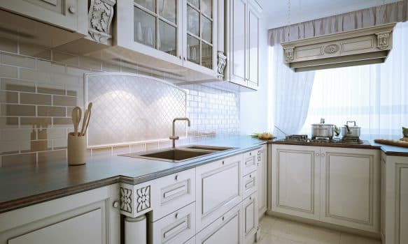 Inspiration for a traditional l-shaped eat-in kitchen with an undermount sink, recessed-panel cabinets, snowy-white cabinets, granite countertops, stone tile backsplash and stainless steel appliances.