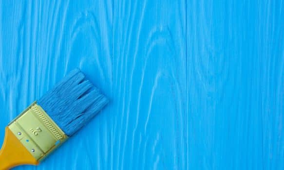 A brush painted on a blue background.