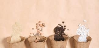 several peat pots with different ingredients for preparing fertile soil for plants, stones for drainage, perlite, soil for seedlings, fertilizer for the garden