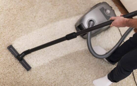 Close up of vacuuming a carpet