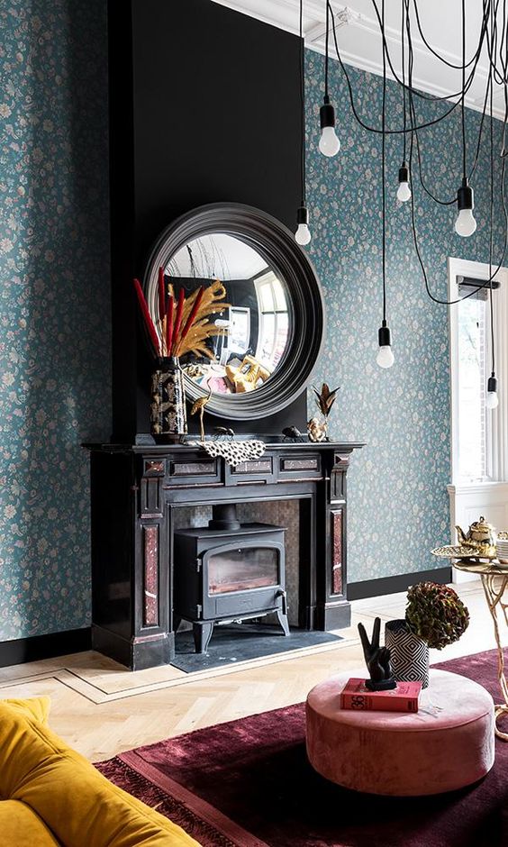 Baroque inspire fireplace mantel with immense mirror and floral wallpaper