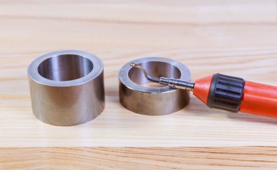 The process of deburring metal. Deburring tool for metal, wood, aluminum, copper and plastic.