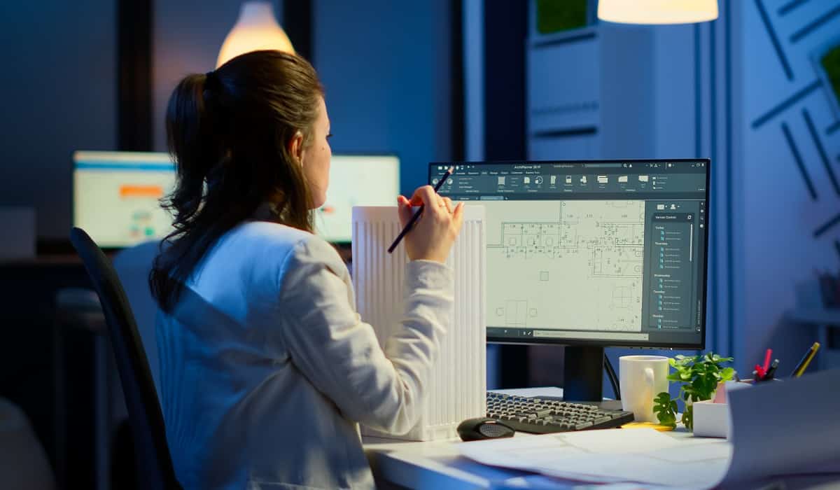 Engineer constructor designer architect creating new component in cad program working in business office. Industrial woman employee studying prototype idea showing cad software on device display