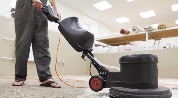 Carpet chemical cleaning with professionally disk machine. Early spring cleaning or regular clean up. High quality photo