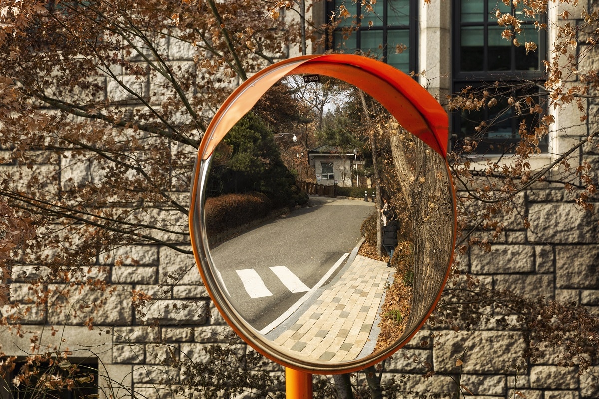 Mirror on the road for visibility. Spherical mirror.
