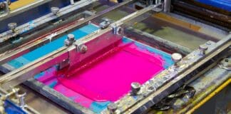 Serigraphy Printer ink machine pink magenta color in printing factory. Types Of Screen Printing.