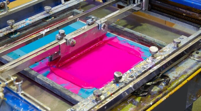 Serigraphy Printer ink machine pink magenta color in printing factory. Types Of Screen Printing.