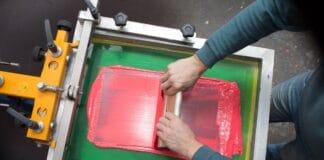 Silk screen printing. Serigraphy. Color paints and fabric. Plastisol paint and squeegee. What Are The Advantages And Disadvantages Of Screen Printing.