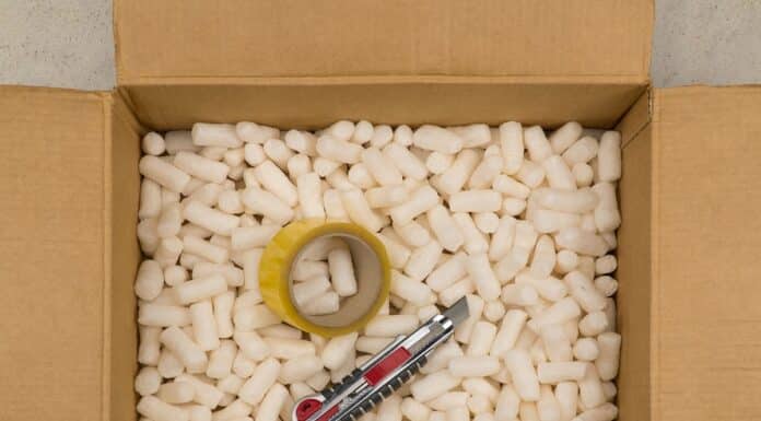 Cardboard box with styrofoam filler for safe packaging. Stationery knife and tape inside. Eco Friendly Bean Bag Filler.