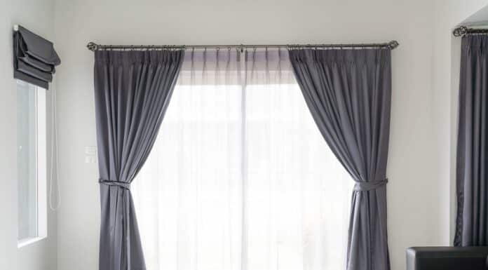Curtain interior decoration in living room with sunlight. Do Blackout Curtains Keep Heat Out.