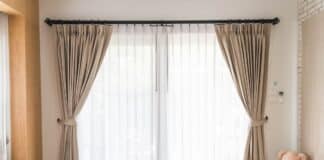 Curtain interior decoration in living room with sunlight. How To Combine Sheer And Blackout Curtains.