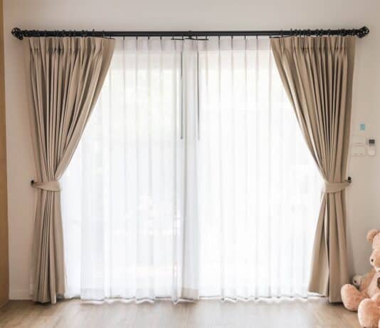 Curtain interior decoration in living room with sunlight. How To Combine Sheer And Blackout Curtains.