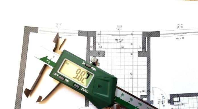 digital caliper over the blueprint of an apartment