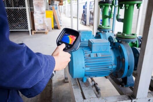 Technician use thermal imaging camera to check temperature in factory. Current applications of thermal imaging systems