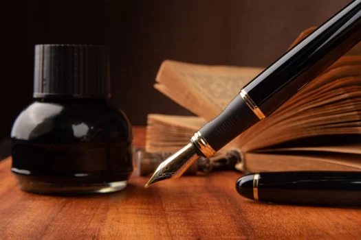 Fountain pen, a beautiful fountain pen on a rustic wooden surface, selective focus. How to change fountain pen ink conclusion.