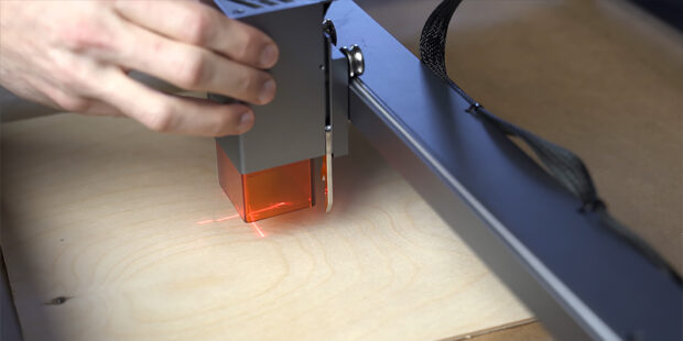 Hand adjusting laser engraver