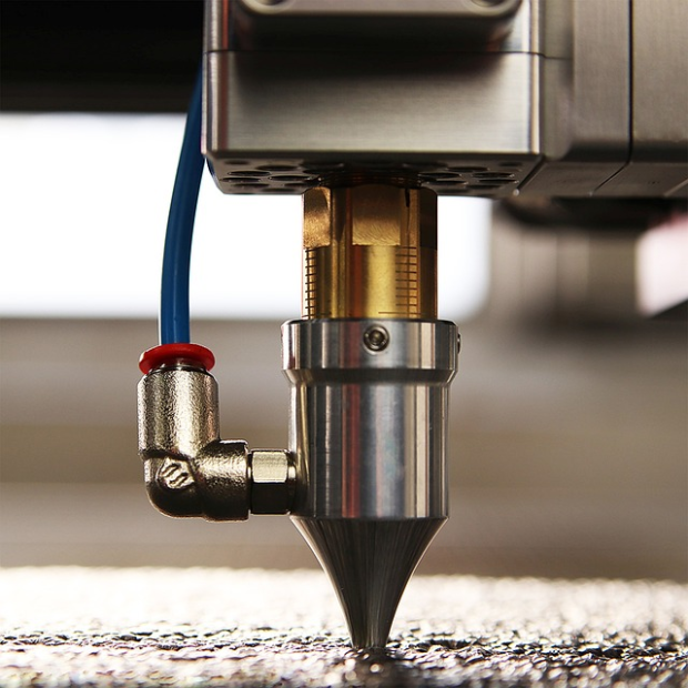 Closed up view of a laser engraver machine head lens