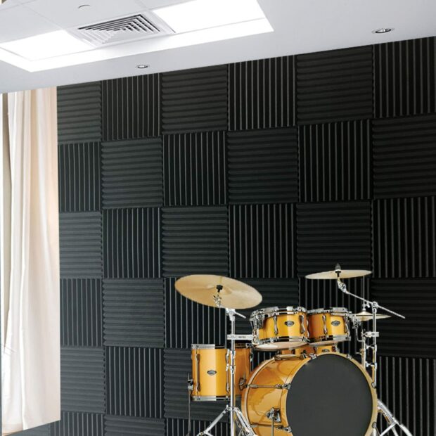 Room with soundproof panels and a drum kit