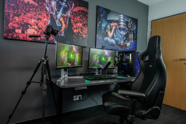 Gaming setup with dual monitors in a room