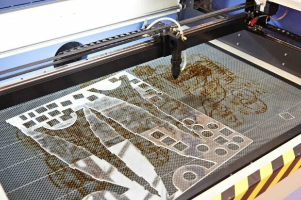 Laser engraver engraving acrylic material
