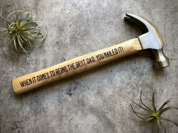 Wooden hammer engraved with a message