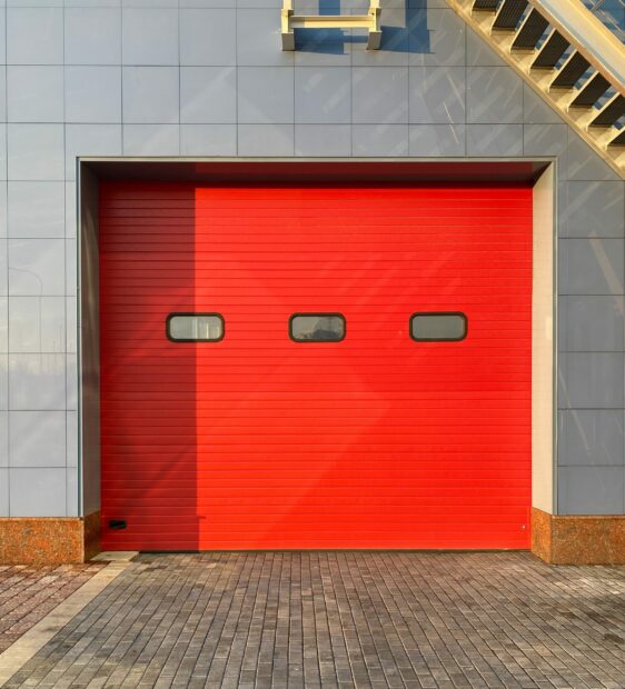 Red garage door with a fire exit stairs